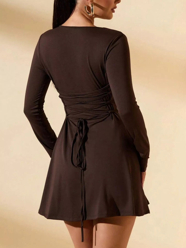 Round Neck Long Sleeve Dress with tied waist detail, fitted mini silhouette, and sleek long sleeves for a polished feminine look.