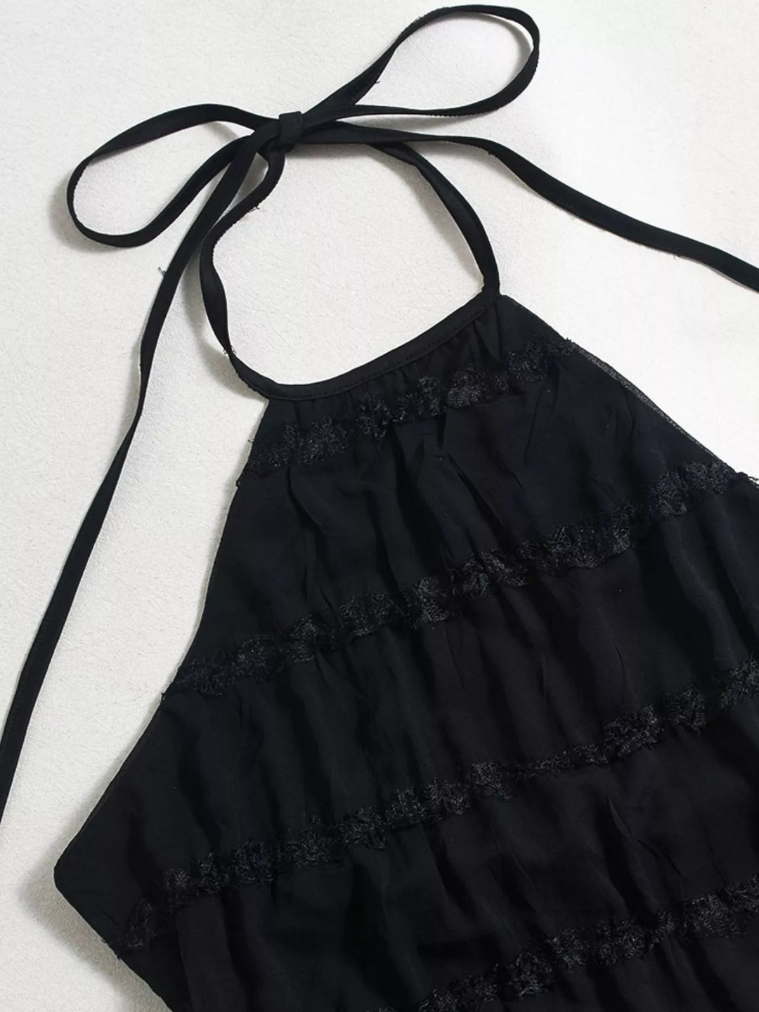 Ruched Halter Maxi Dress with tie neckline, smocked waist detail, flowing full-length skirt, and elegant draped silhouette.