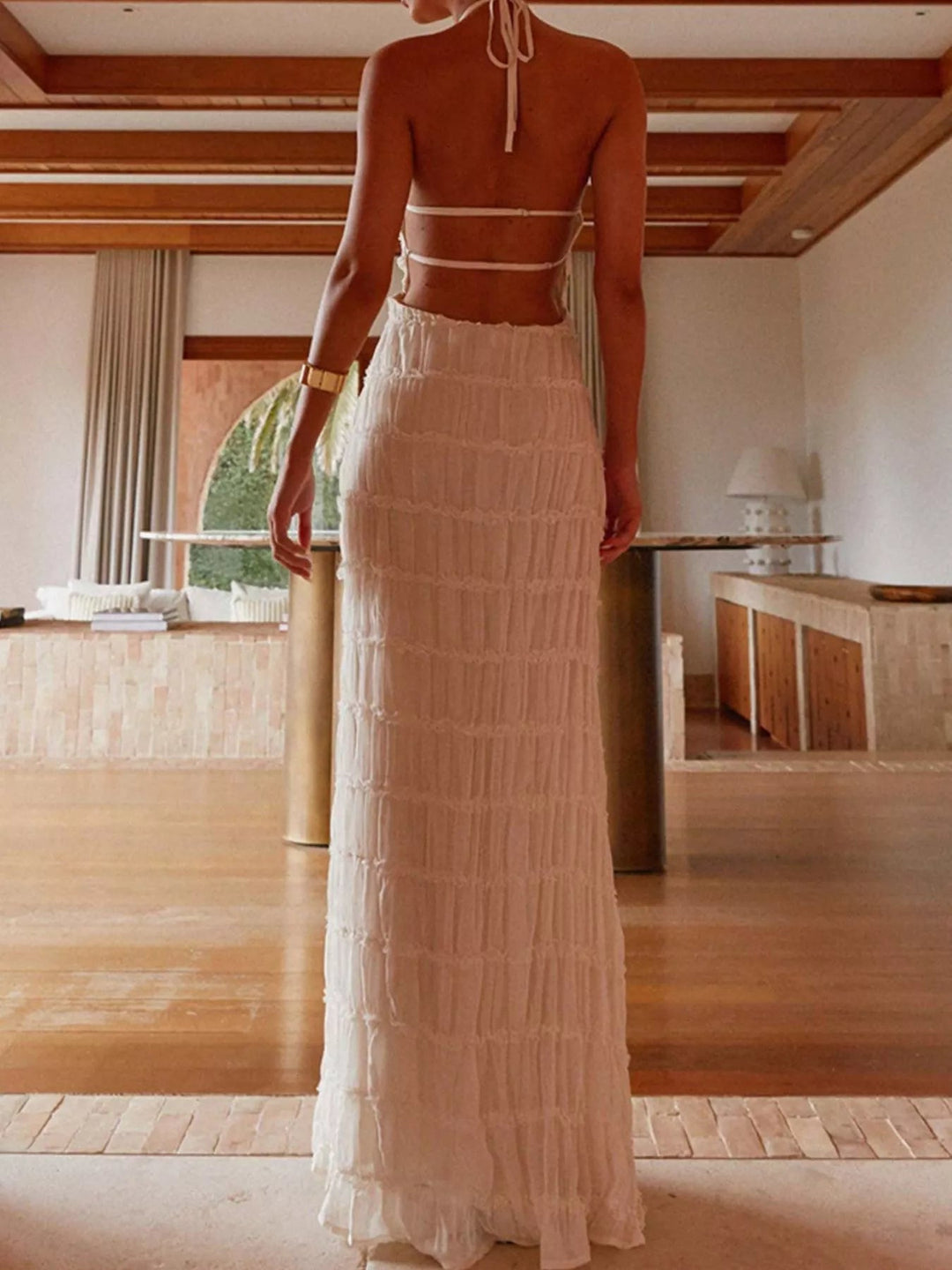 Ruched Halter Maxi Dress with tie neckline, smocked waist detail, flowing full-length skirt, and elegant draped silhouette.