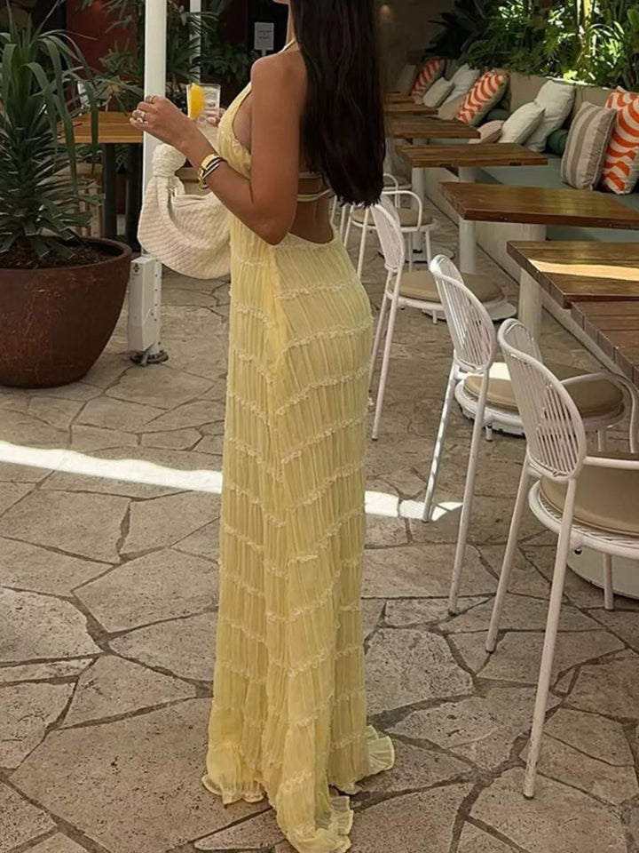 Ruched Halter Maxi Dress with tie neckline, smocked waist detail, flowing full-length skirt, and elegant draped silhouette.