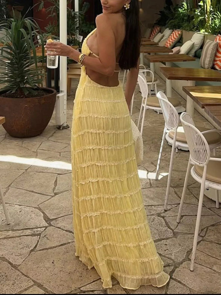 Ruched Halter Maxi Dress with tie neckline, smocked waist detail, flowing full-length skirt, and elegant draped silhouette.