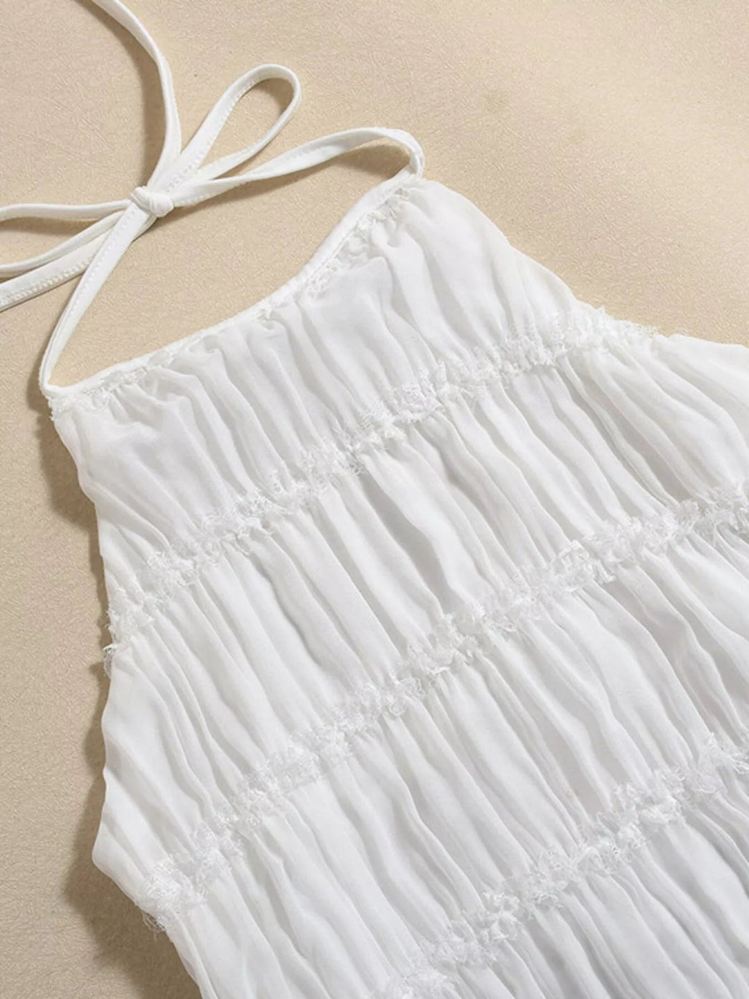 Ruched Halter Maxi Dress with tie neckline, smocked waist detail, flowing full-length skirt, and elegant draped silhouette.