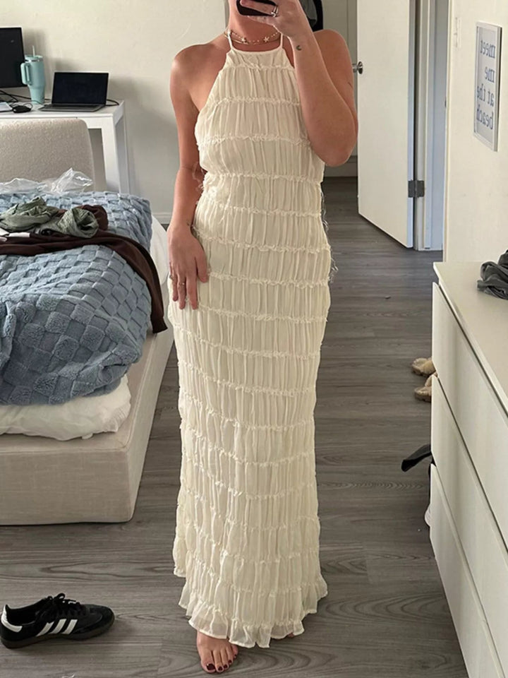 Ruched Halter Maxi Dress with tie neckline, smocked waist detail, flowing full-length skirt, and elegant draped silhouette.