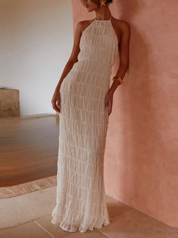 Ruched Halter Maxi Dress with tie neckline, smocked waist detail, flowing full-length skirt, and elegant draped silhouette.