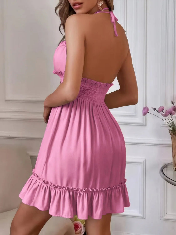 Smocked Halter Mini Dress featuring ruffled frill details, smocked bodice, backless design, and feminine mini silhouette