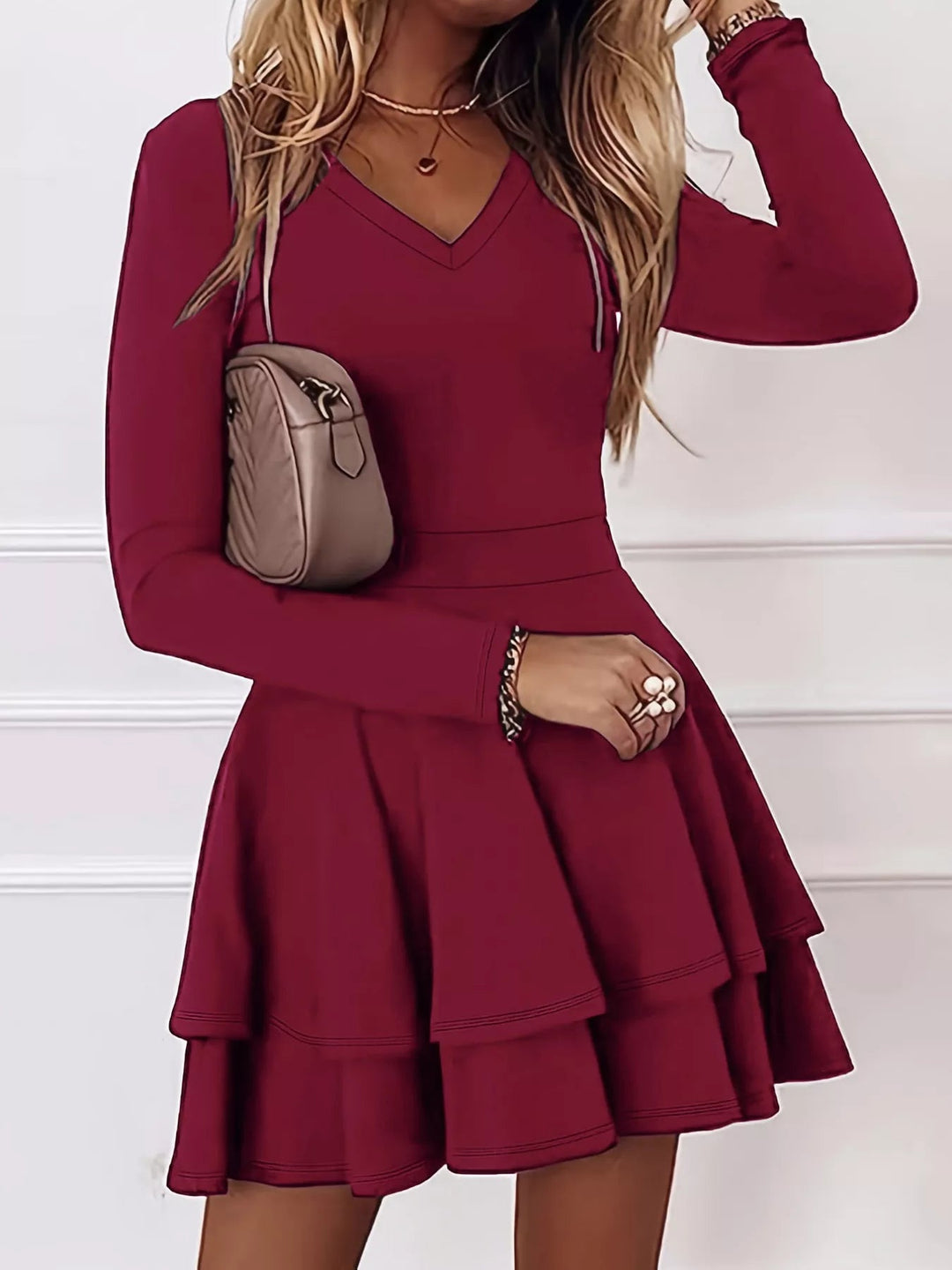 V-Neck Ruffle Mini Dress with layered tiers and flowing silhouette in soft stretch fabric, featuring a flattering V neckline