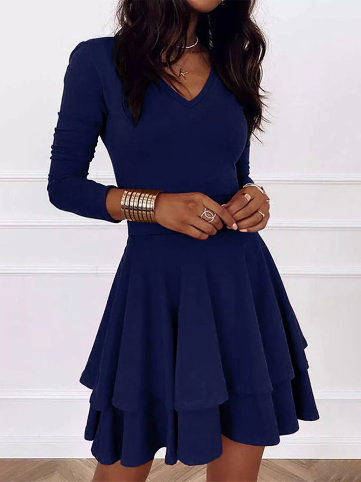 V-Neck Ruffle Mini Dress with layered tiers and flowing silhouette in soft stretch fabric, featuring a flattering V neckline