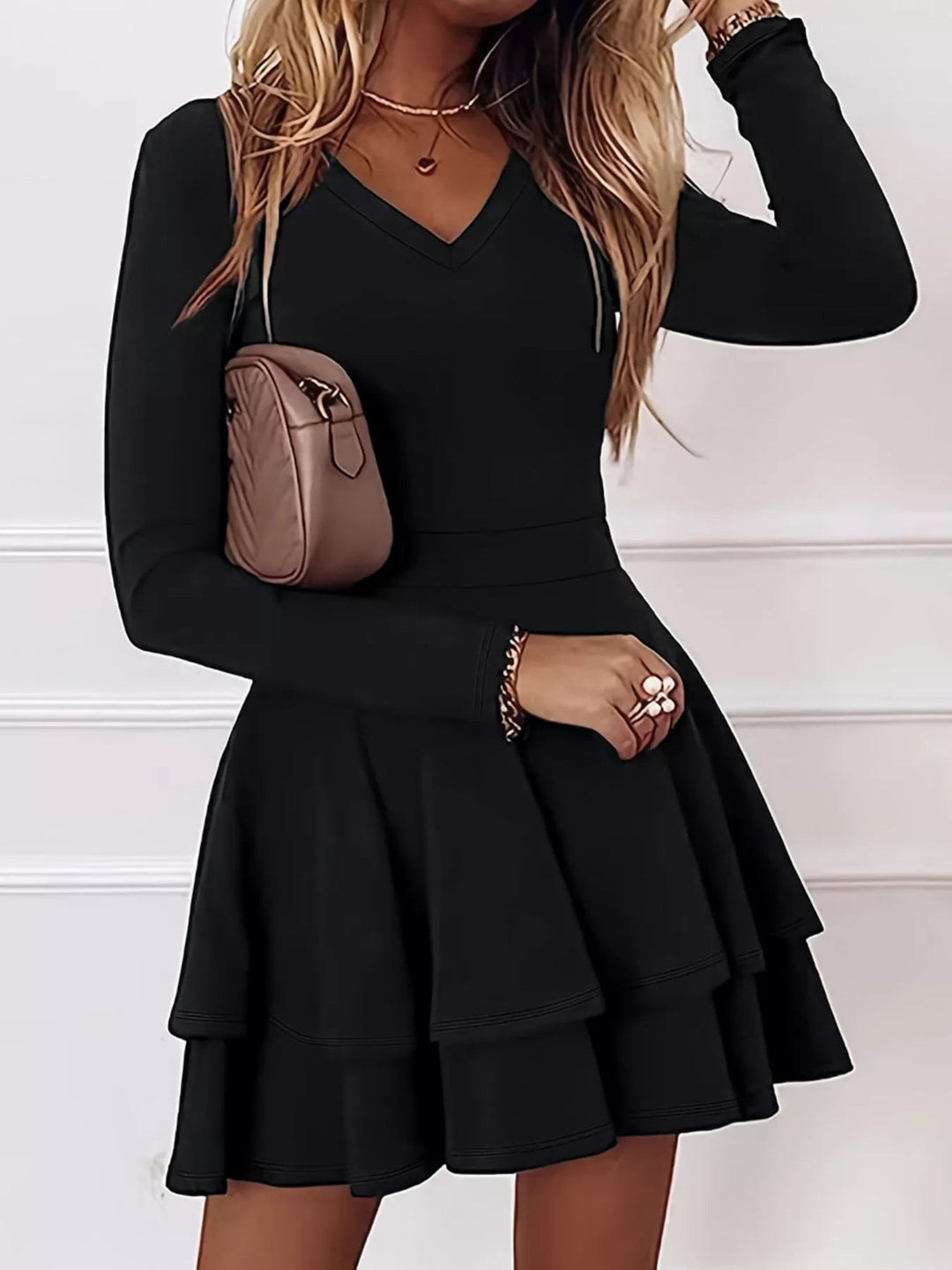 V-Neck Ruffle Mini Dress with layered tiers and flowing silhouette in soft stretch fabric, featuring a flattering V neckline