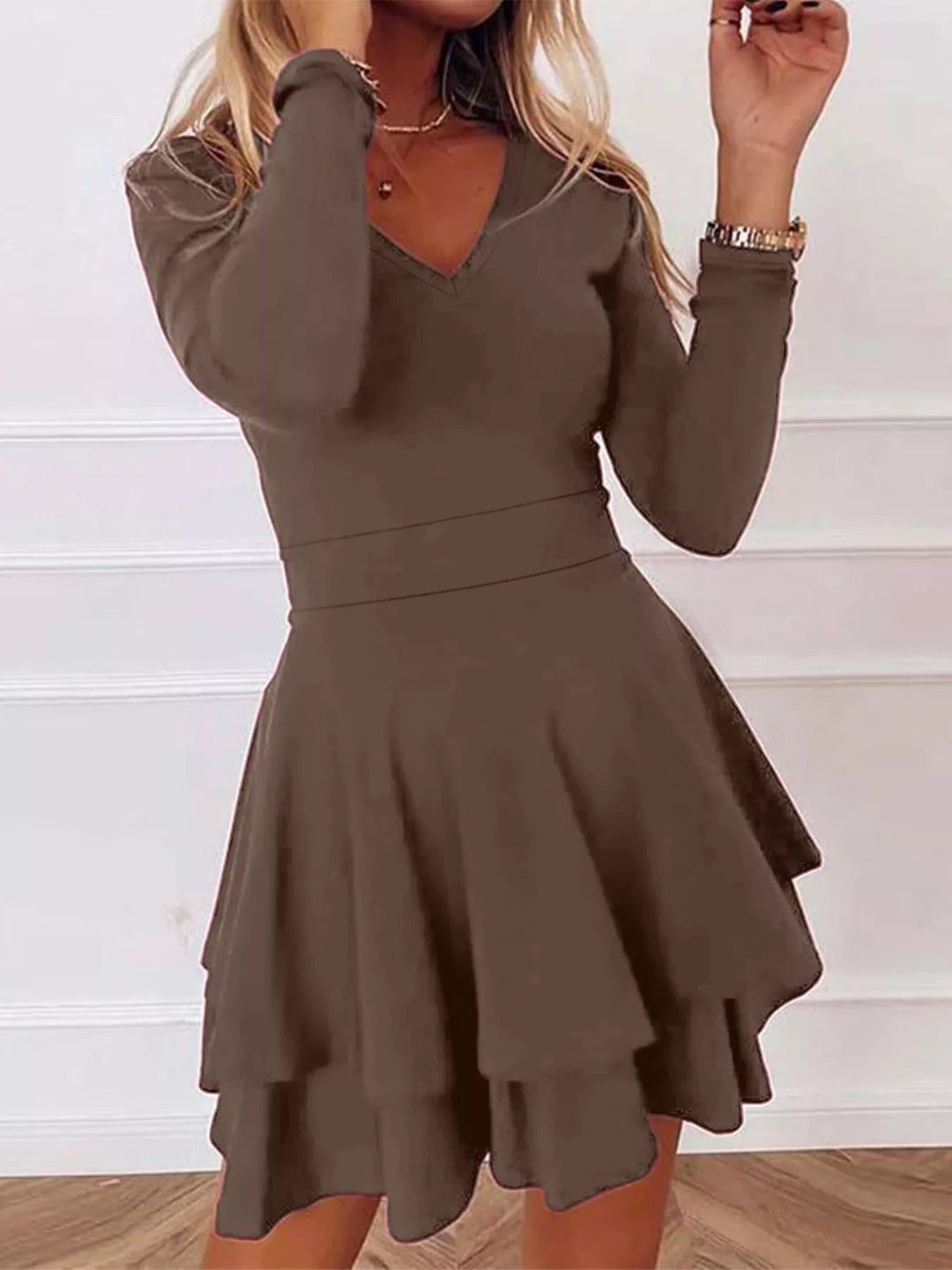 V-Neck Ruffle Mini Dress with layered tiers and flowing silhouette in soft stretch fabric, featuring a flattering V neckline
