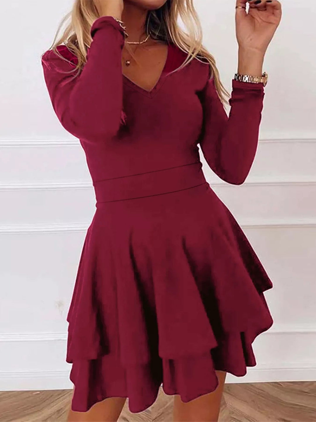 V-Neck Ruffle Mini Dress with layered tiers and flowing silhouette in soft stretch fabric, featuring a flattering V neckline