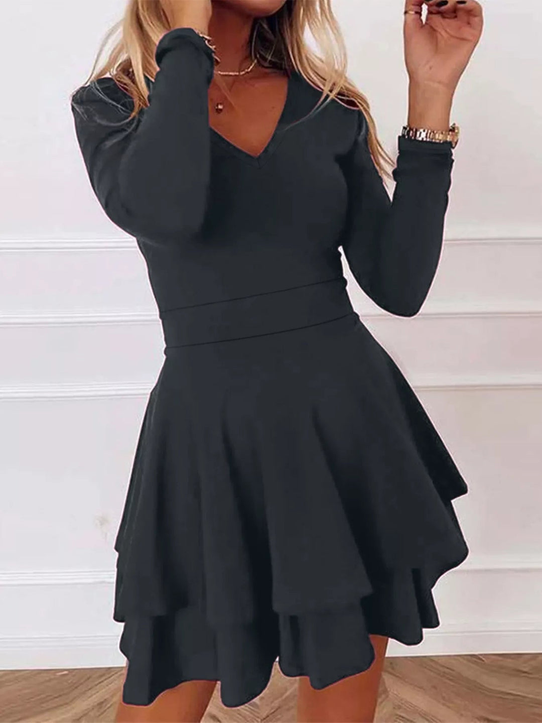 V-Neck Ruffle Mini Dress with layered tiers and flowing silhouette in soft stretch fabric, featuring a flattering V neckline