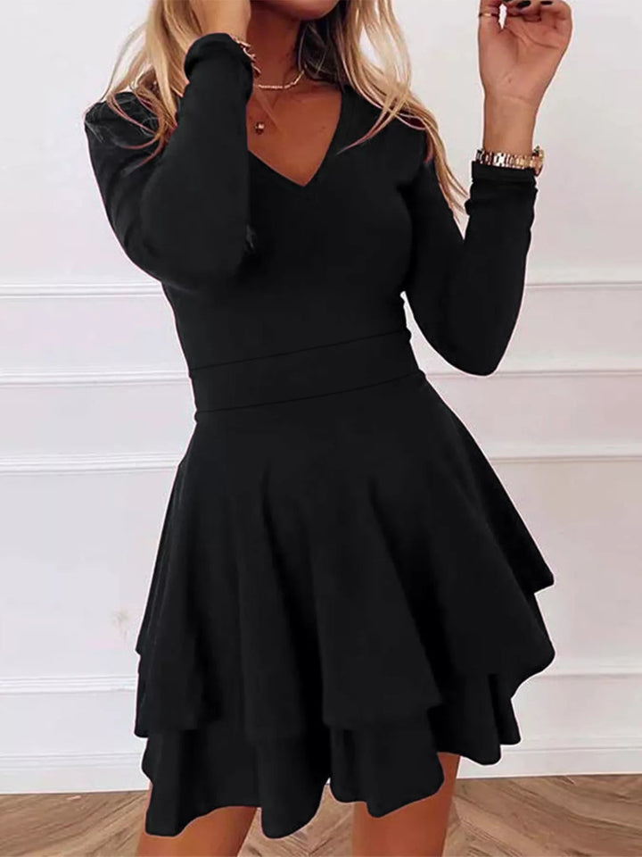 V-Neck Ruffle Mini Dress with layered tiers and flowing silhouette in soft stretch fabric, featuring a flattering V neckline
