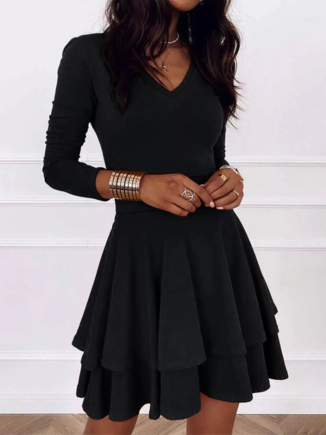 V-Neck Ruffle Mini Dress with layered tiers and flowing silhouette in soft stretch fabric, featuring a flattering V neckline