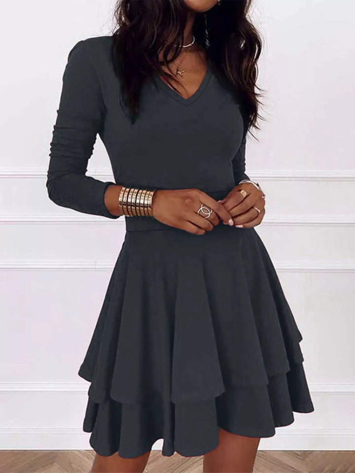 V-Neck Ruffle Mini Dress with layered tiers and flowing silhouette in soft stretch fabric, featuring a flattering V neckline
