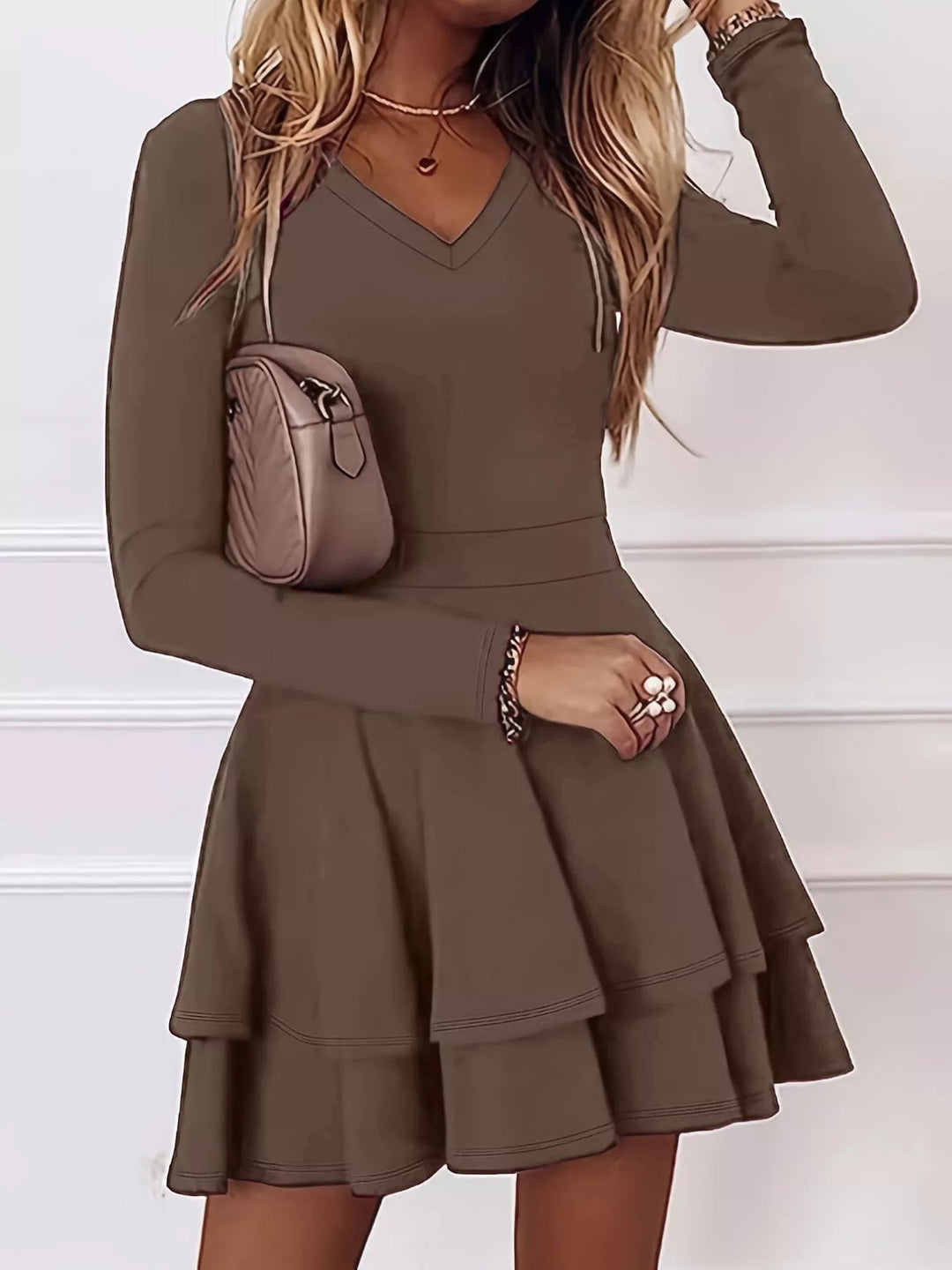 V-Neck Ruffle Mini Dress with layered tiers and flowing silhouette in soft stretch fabric, featuring a flattering V neckline