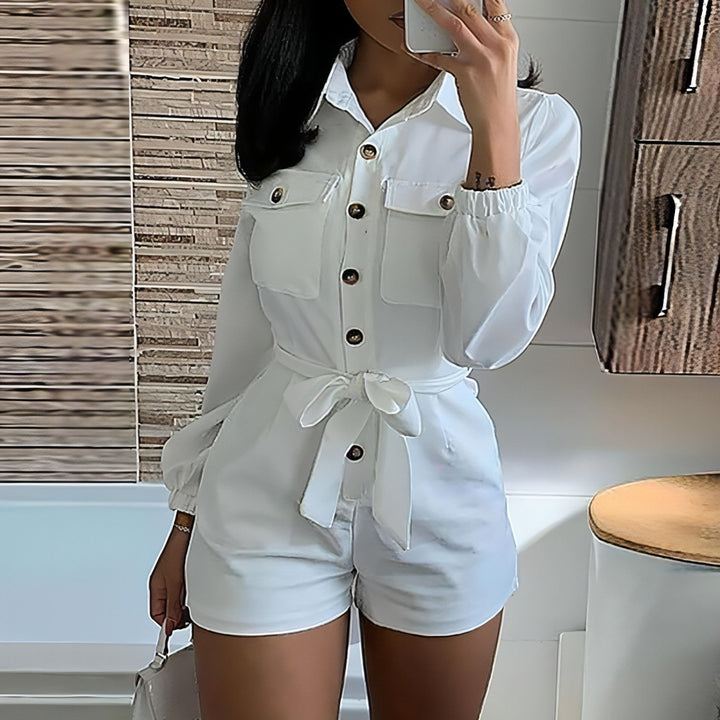 White Woven Casual Jumpsuit with sleeveless design, adjustable waist tie, and relaxed fit