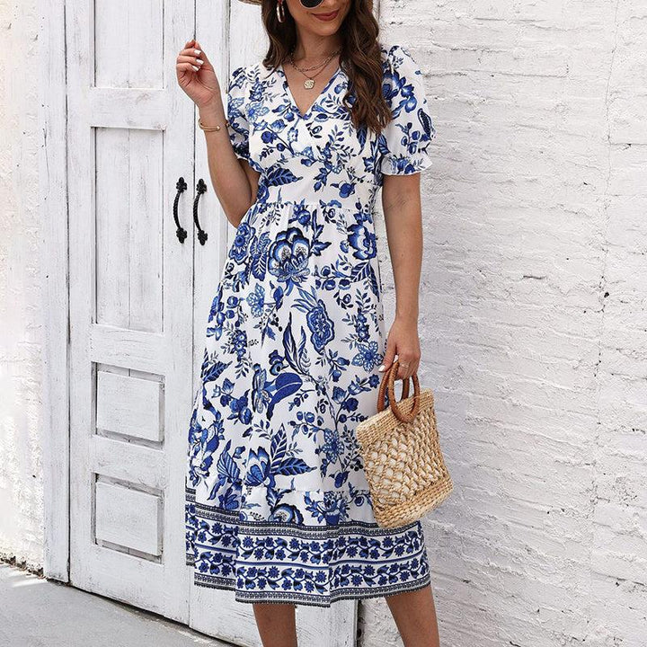 Women’s boho floral maxi dress with V-neck, smocked back, puff sleeves, and flowy silhouette for summer events